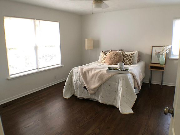 Primary bedroom, hardwood floors, cedar walk in closet.