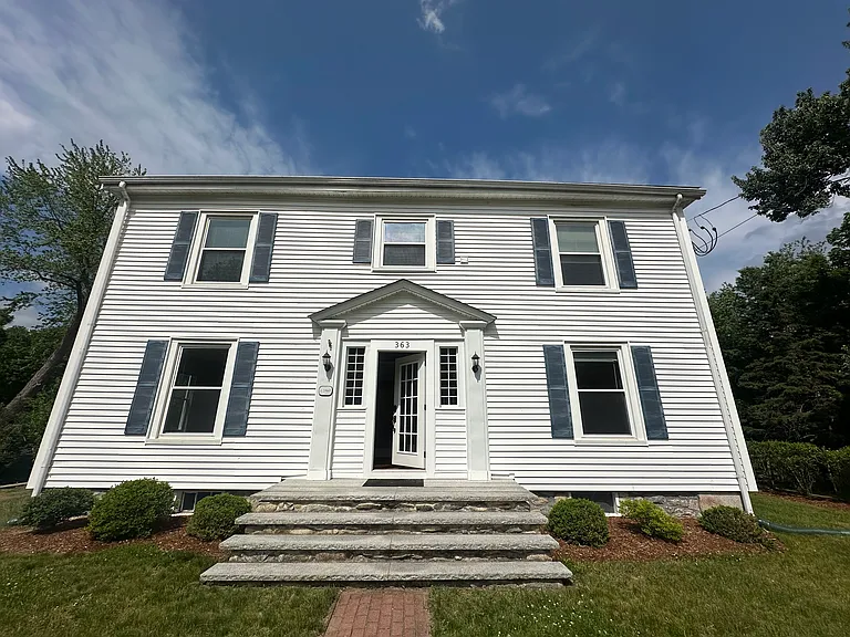 Classic New England two-family with charming curb appeal