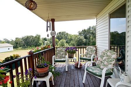This deck is located off the dining room and overlooks backyard & extra garage