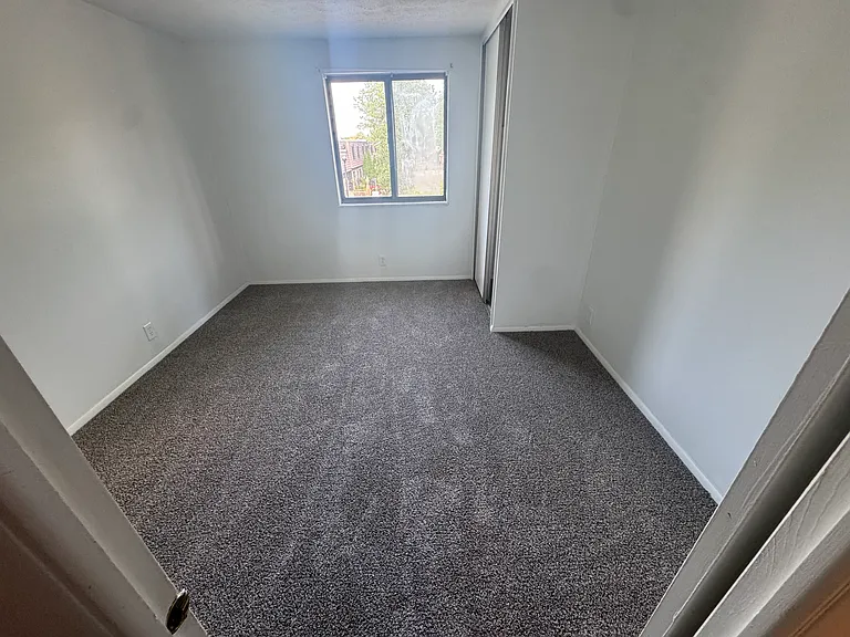 Bedroom 2 with new carpet.