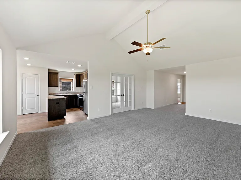 The open layout connects the family room with the kitchen and dining room.