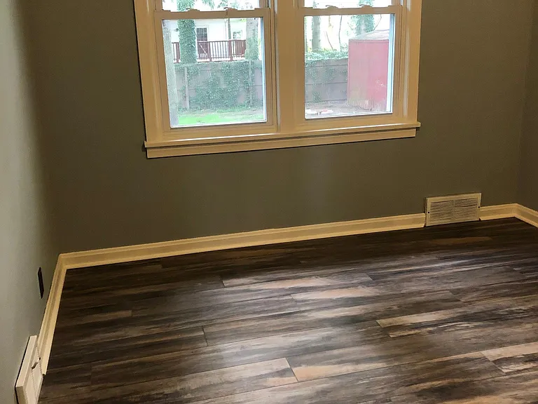 Second bedroom, view out to fenced backyard.