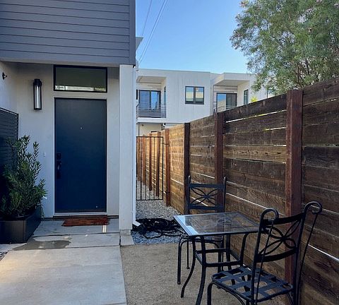 Your private entrance has a gated entry and large front porch. You can lounge, dine and grow your own vegetables in this spacious, private front yard.