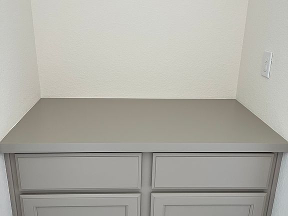 Cabinets next to downstairs bedroom