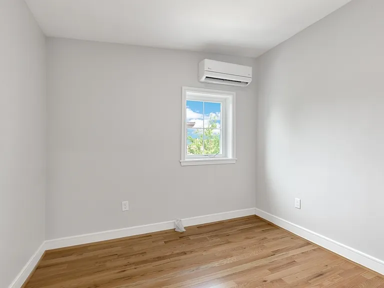The smaller bedroom has one window and large closet.