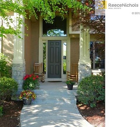 Charming covered porch welcomes you into this inviting home.