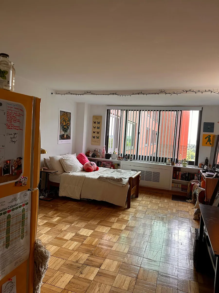 Looking into room as furnished by a past tenant. Photo taken standing at front door with refrigerator on left. - 1021 Arlington Blvd #937
