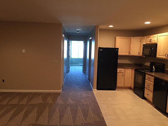 This is the view from the middle of the living room/kitchen that goes down the hallway to the bedrooms/bathrooms. On the left of the hallway is a coat closet. On the right is a full guest bathroom. The 2nd bedroom is straight ahead in the picture. The