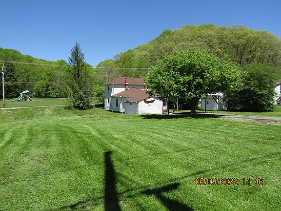 Back of house & two sheds with park across the street