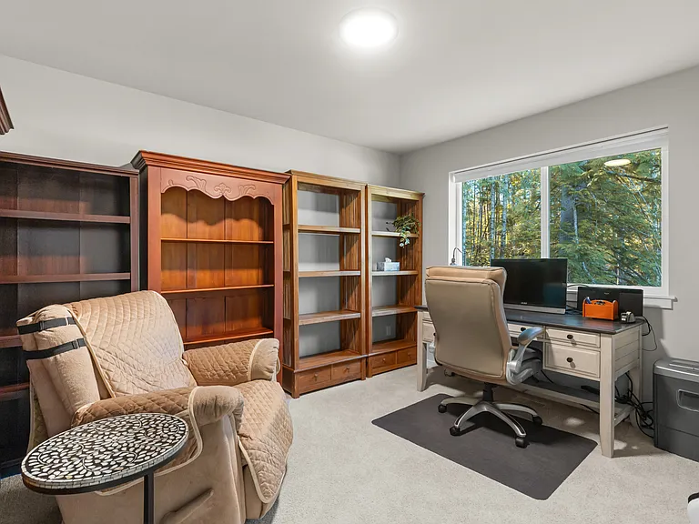Fourth bedroom currently being used as a library and office. Also with a walk in closet