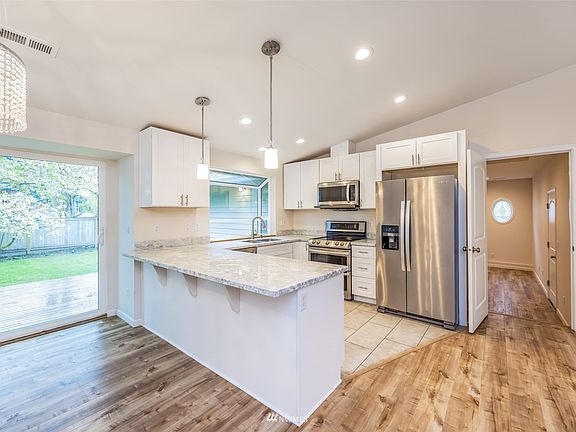 Granite countertop and stainless steel applicances.