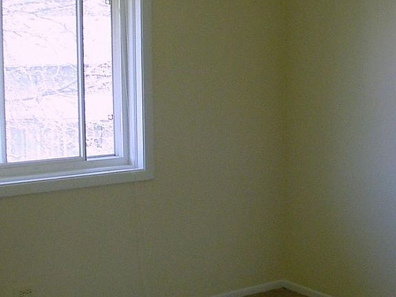 Bedroom. Carpet will be replaced with laminate flooring.