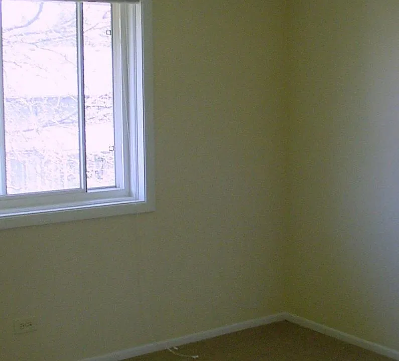Bedroom. Carpet will be replaced with laminate flooring.