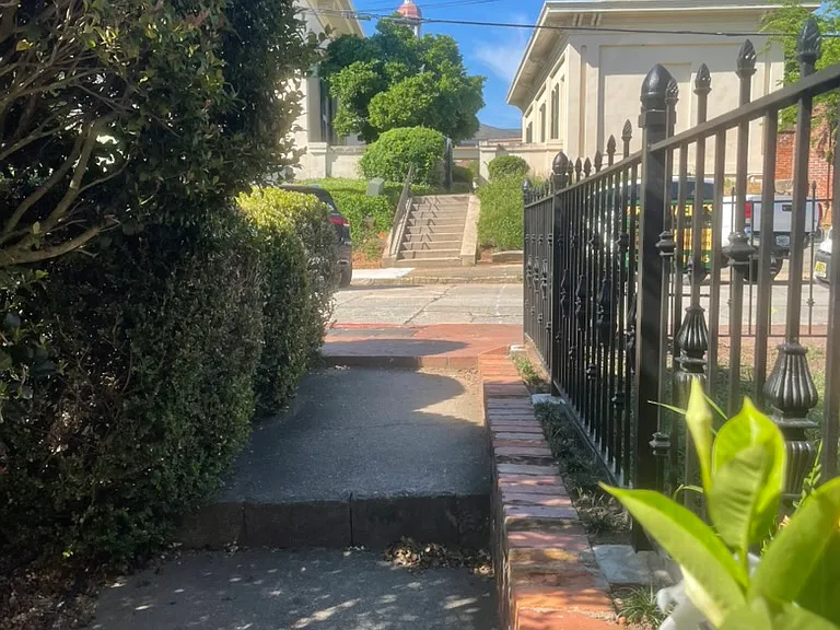 Walkway from 1023 apartment towards Bond Street and Mercer Law School