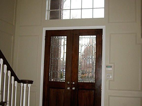 Double door entry with large window above that lets in plenty of natural light