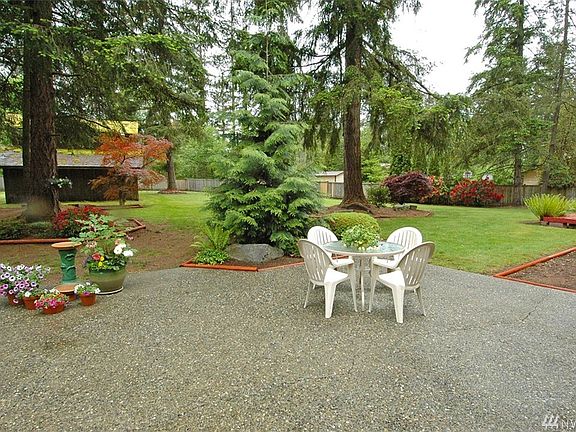 Back patio with views of the impeccably landscaped yard