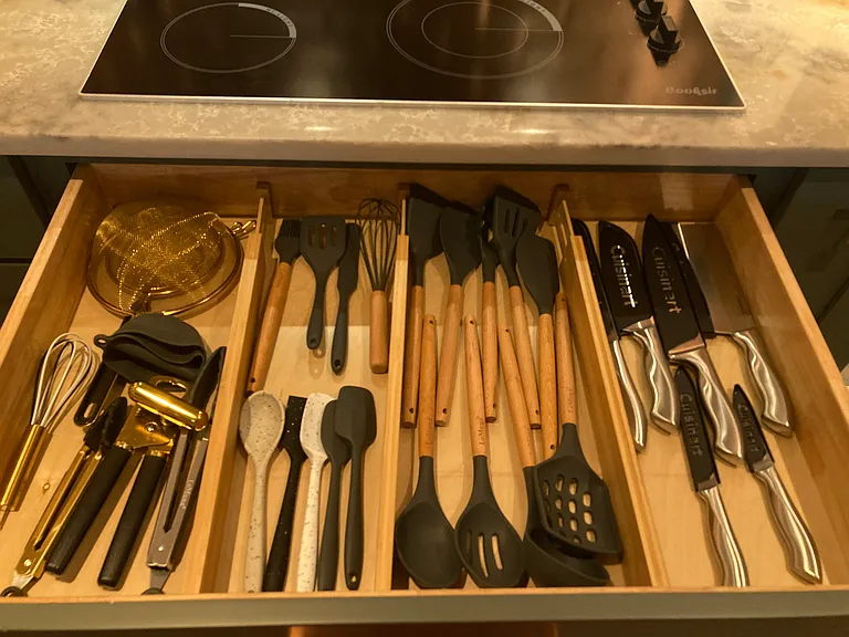 Variety of stylish utensils for cooking, serving, and frying.