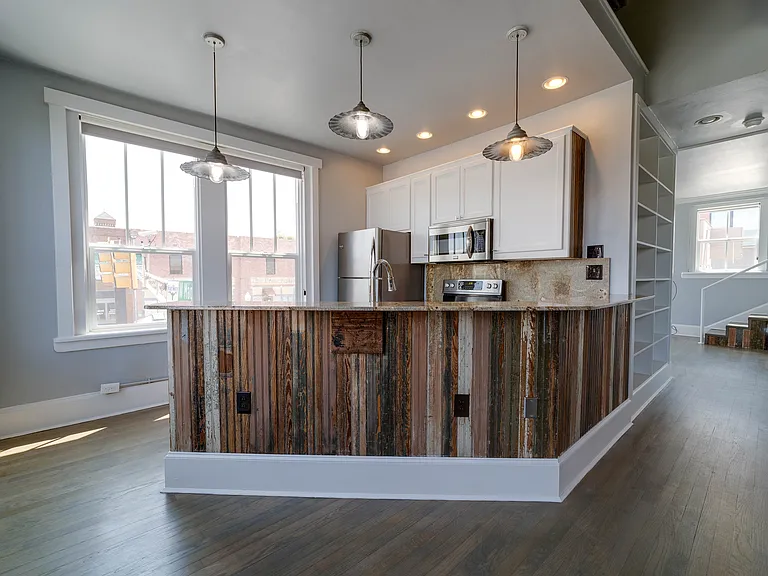 Kitchen located at the corner of the unit