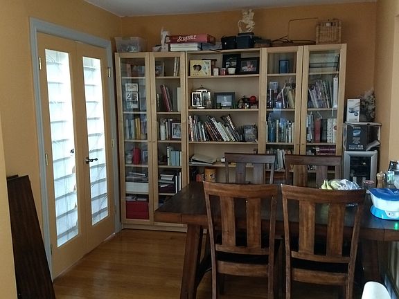 Dining room with doors to bonus room