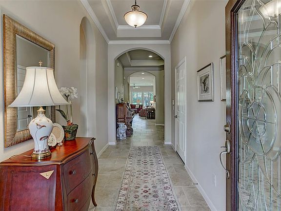 Walk in to your retreat-from the front entrance through to the family room. Architectural interests include 2 trayed ceiling, arches and crown molding.