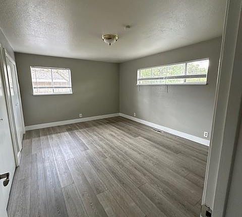 Large master bedroom with wall to wall closet and closet organizer