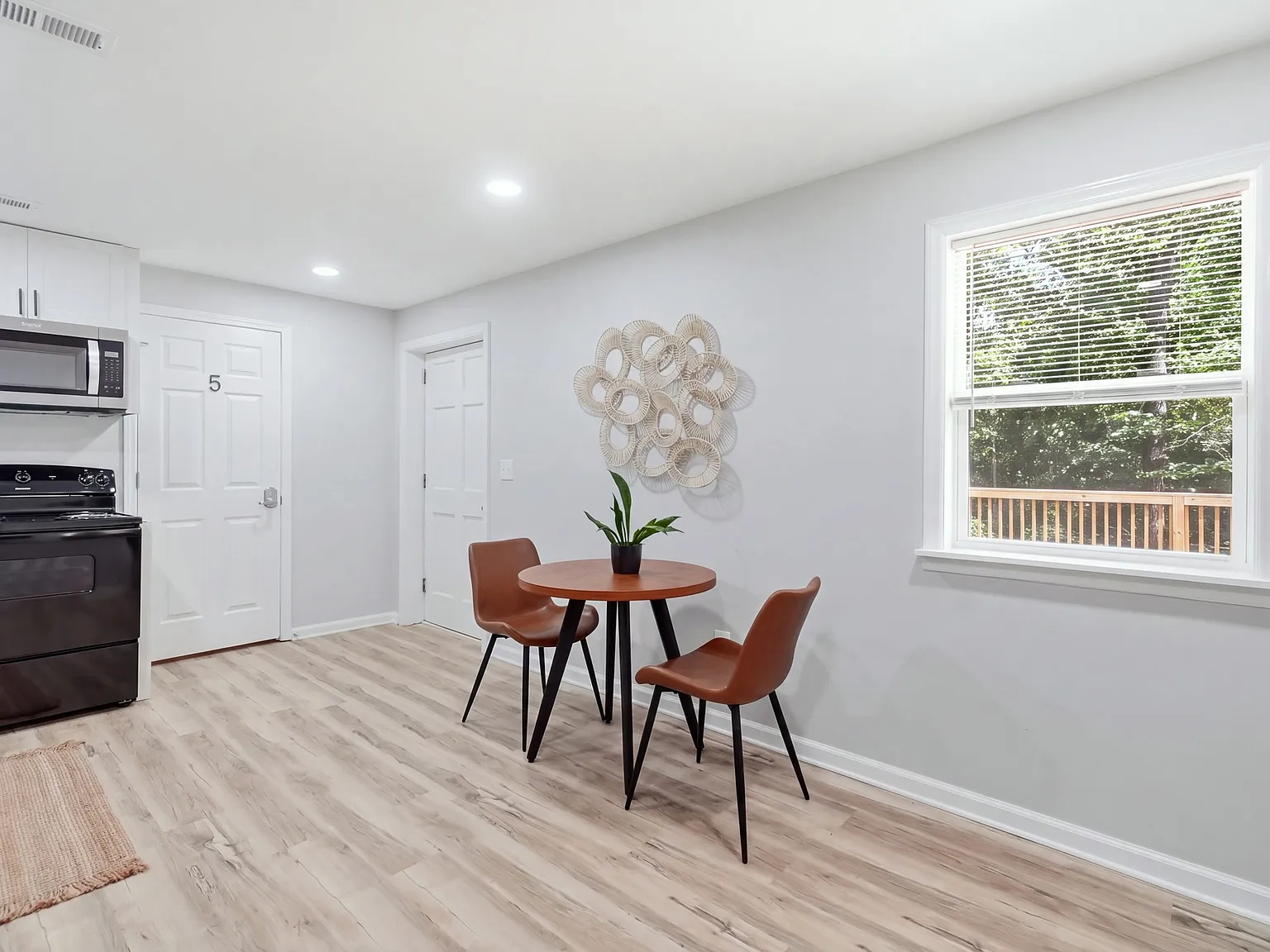 Shared dining area with comfortable seating and bright natural light.