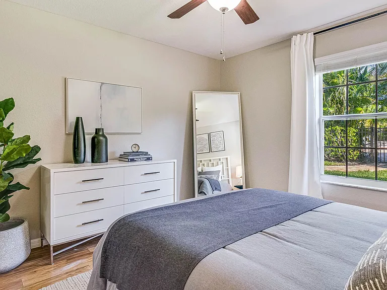 Each bedroom includes a multi-speed ceiling fan and large window.