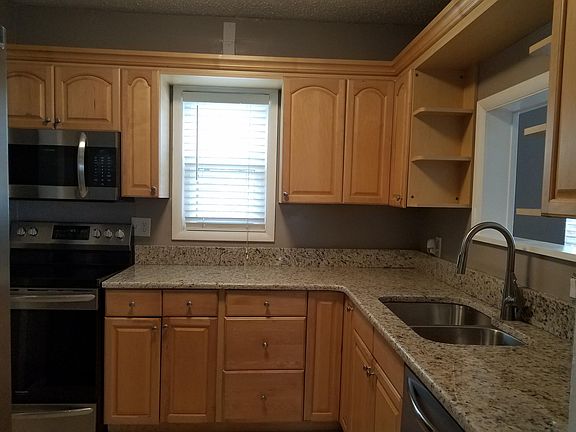 Kitchen with new granite counter tops and new SS appliances