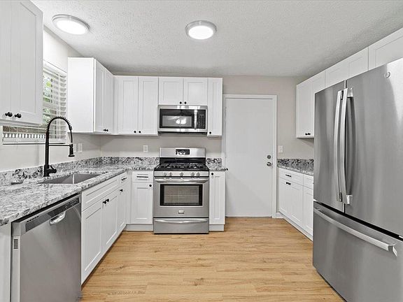 Brand new soft close cabinets with granite counter top and deep sink along with stainless steel appliances.