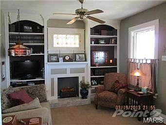 Living Room w/ Built in Bookcases.