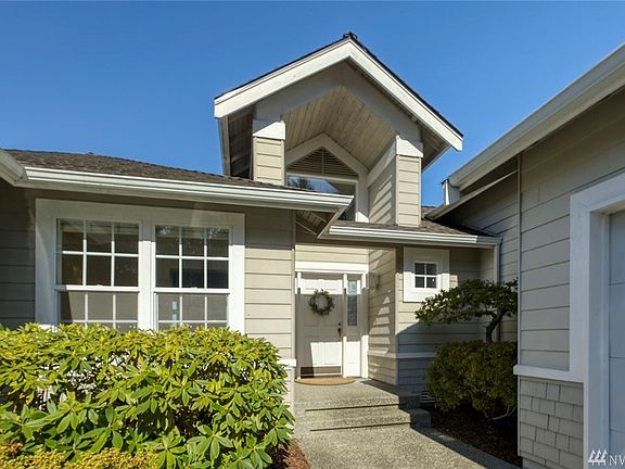 Covered entryway and tidy landscaping welcome guests.  Teal Lake Village HOA dues include lawn moving,  landscape maintenance, and irrigation management.  