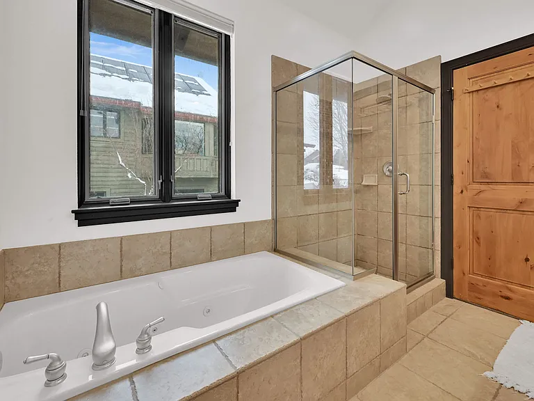 Master bathroom with large tub and walk in shower