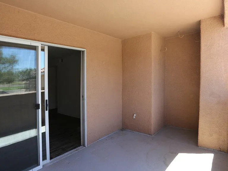 Private patio with a sliding glass door