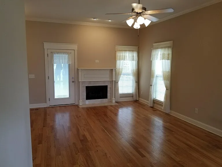 Spacious living room with a gas fireplace.