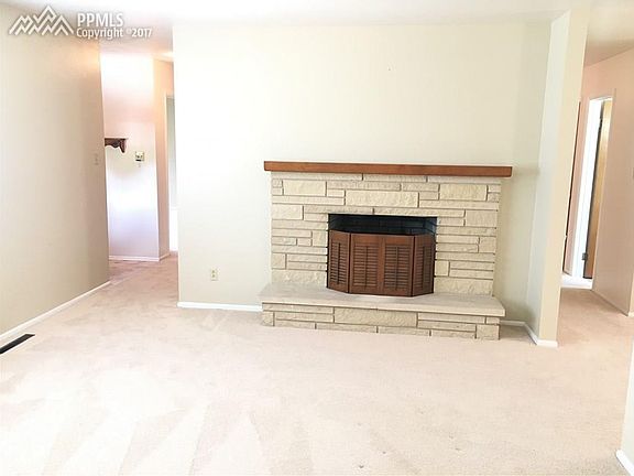 Flagstone wood-burning fireplace in formal Living Room.