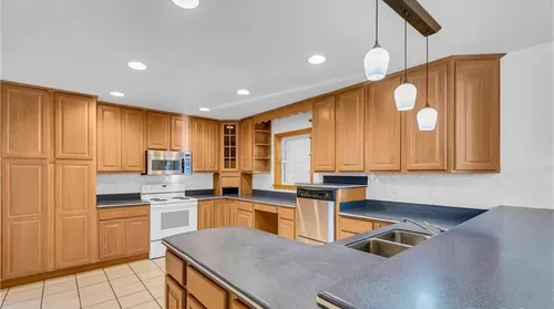 Kitchen with room for gathering. - 53 Orchard Park Rd