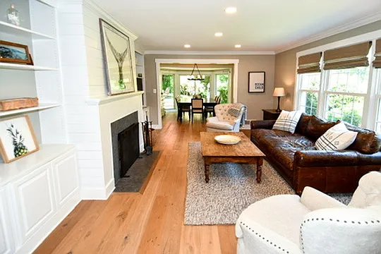 Spacious main living room with TV and fireplace