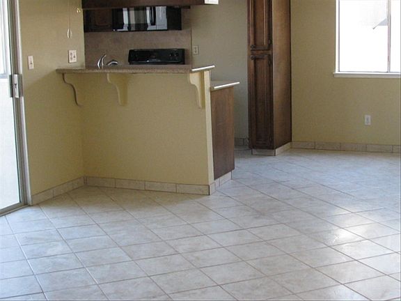 Tile floors, granite counters with tile backsplash