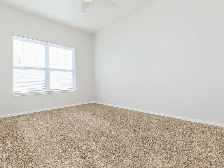 Spacious Bedroom with Modern Amenities at Southwest Pines in Tyler, TX
