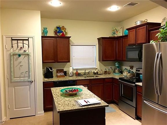 Kitchen with upgraded range and refrigerator