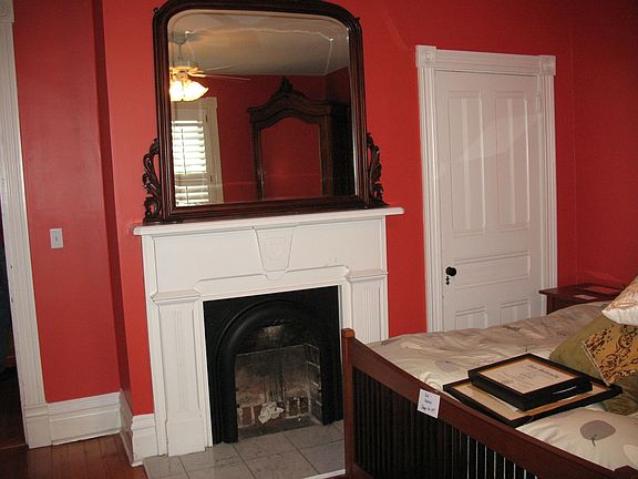 Charming Fireplace Mantel in One of the Bedrooms