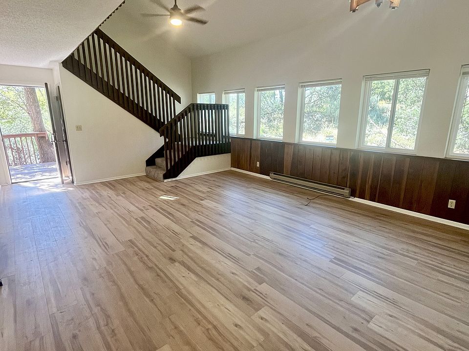 Living Room. New flooring and blinds, as well as newly stained window sills.