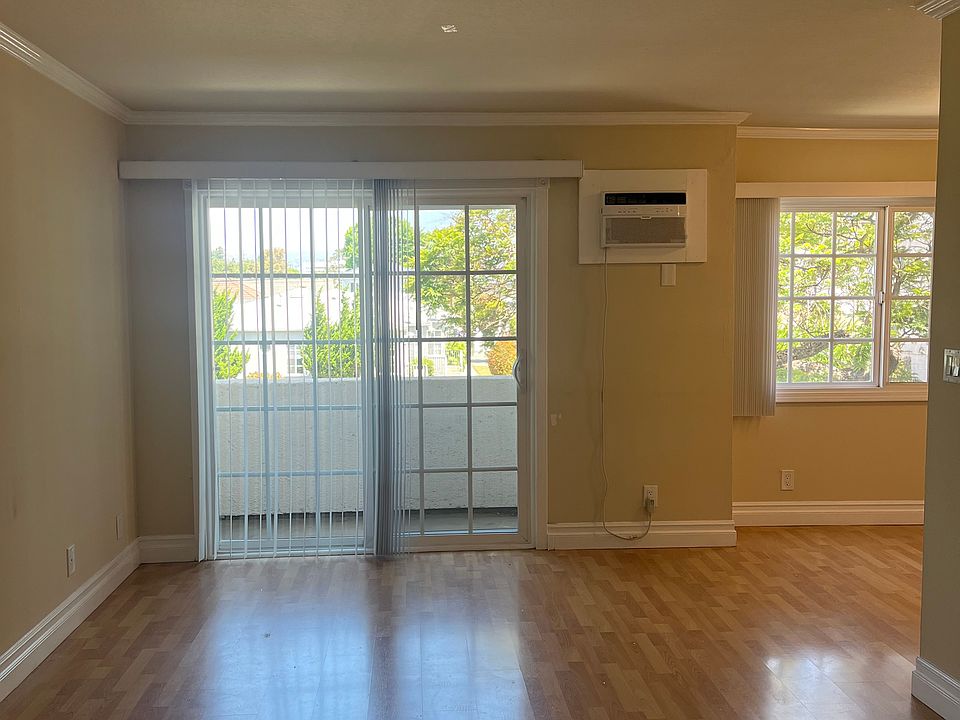 Living Room with Attached Sliding Door Leading to Balcony