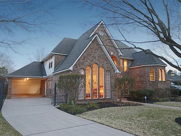Enjoy the privacy of your own wrought iron driveway gate, and extra covered parking under the porte-cochere.