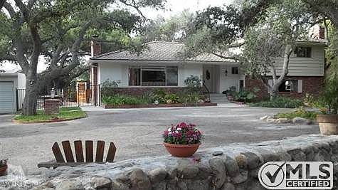 Brick on bottom right of home is the front of the attached guest quarters of 2 bedrooms, full bath, 