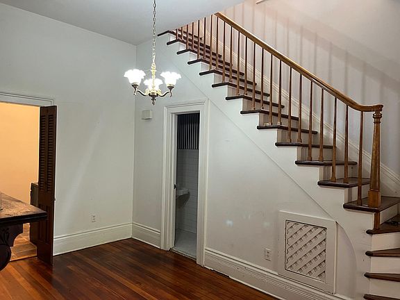 stairs leading up to two bedrooms and full bath