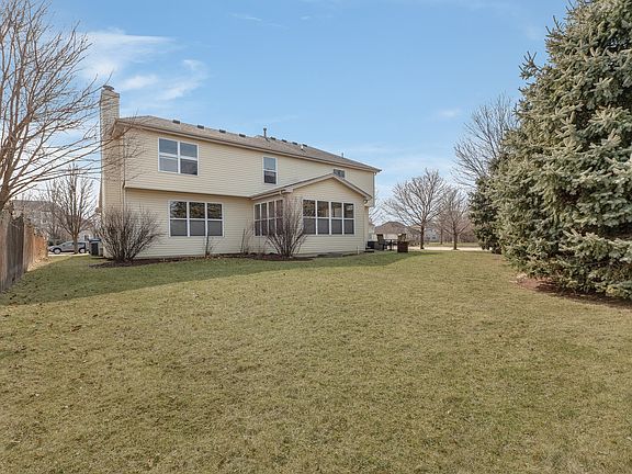 The corner lot has a view of the mature spruce trees that provide screening for privacy.
