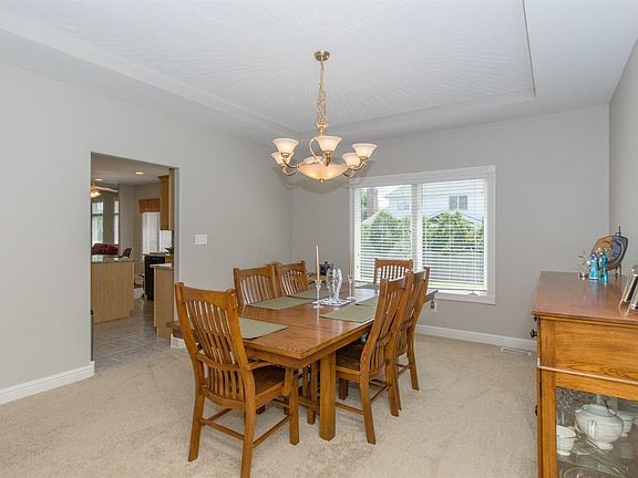 Directly off of the kitchen and front living room is this spacious formal dining room.