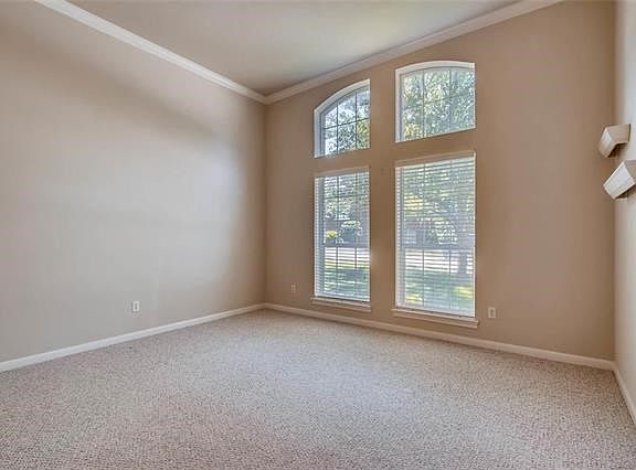 Living room with floor to ceiling windows.