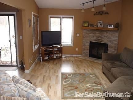 LIVING ROOM : New flooring with matching fireplace stone through entire living room.